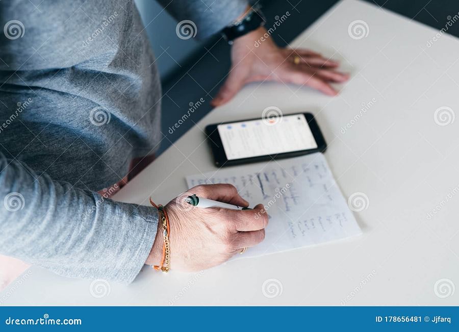 woman creating a shopping list